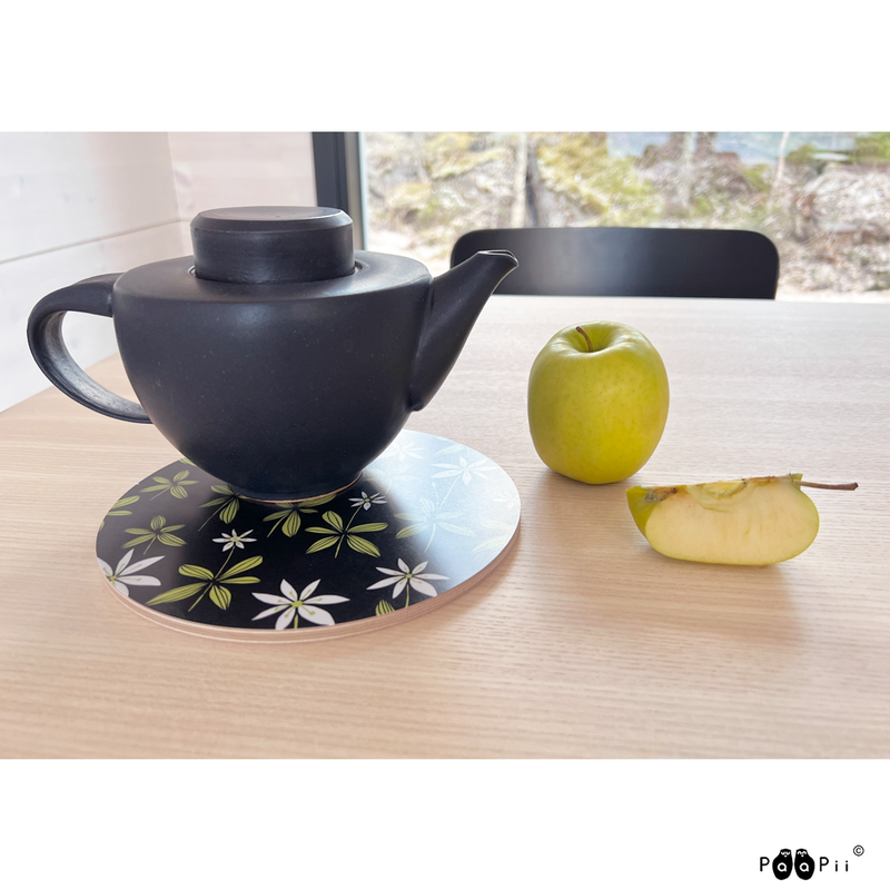 Black teapot on Paapii Starflower Birch Trivet