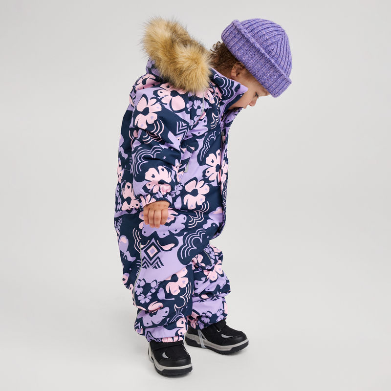 toddler wearing purple snowsuit