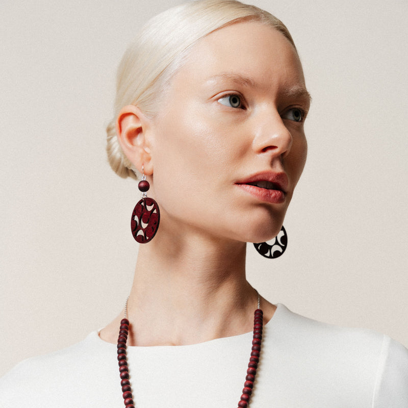 large red earrings with cutouts